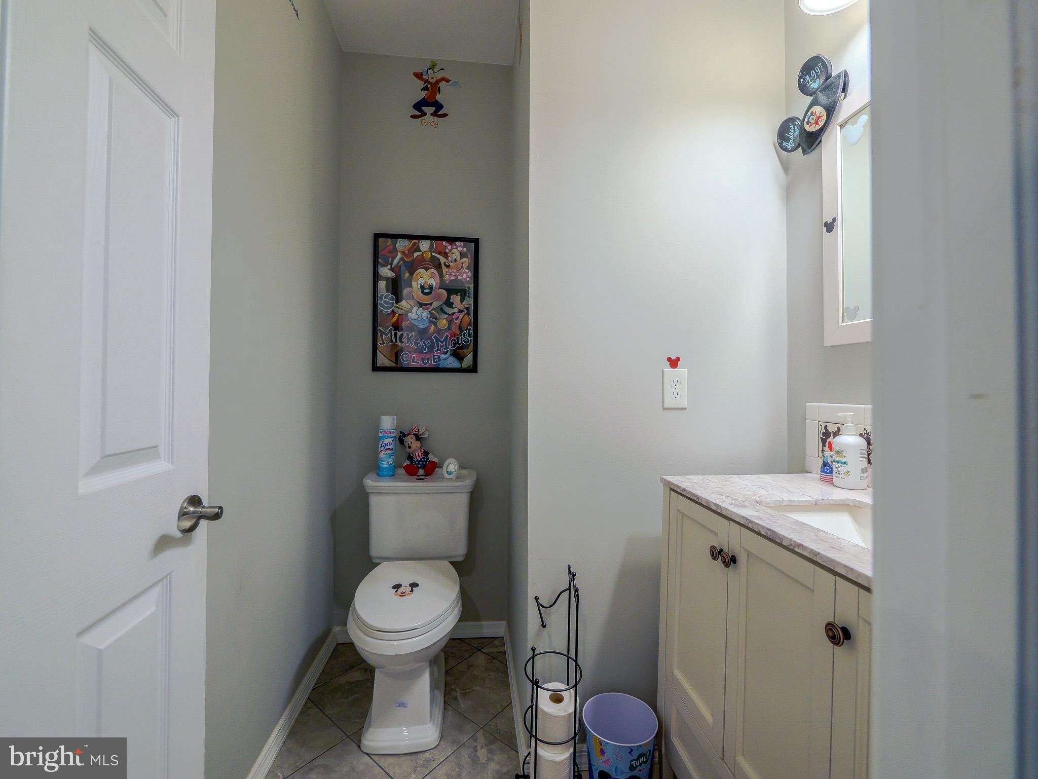 559 Franklinville Road Mullica Hill, NJ 08062 - Photo 15 of 41 a white toilet sitting next to a bathroom sink