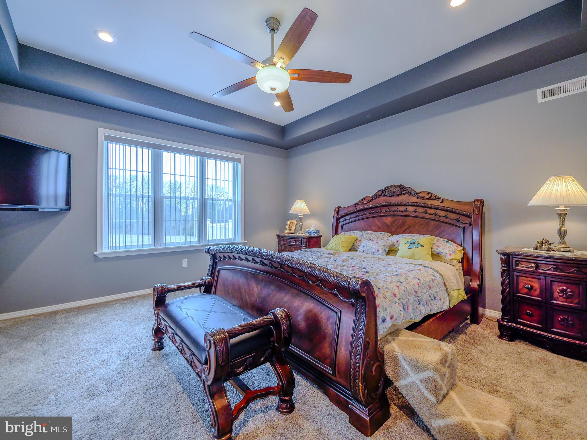 559 Franklinville Road Mullica Hill, NJ 08062 - Photo 18 of 41 a bedroom with a bed and a chandelier
