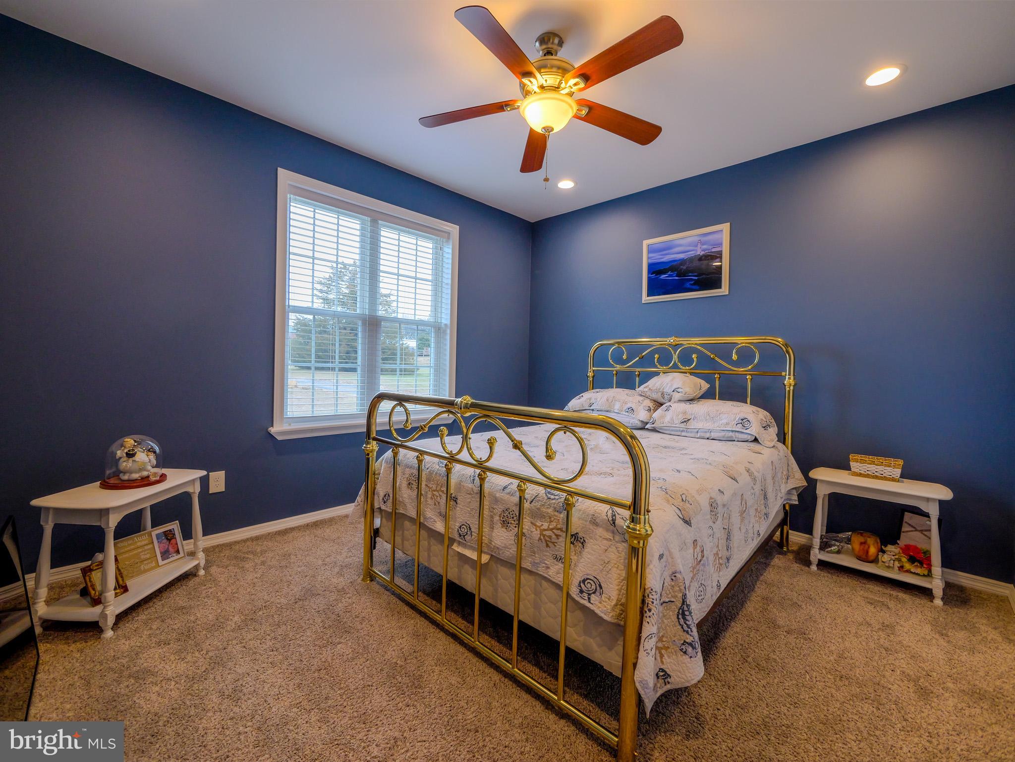 559 Franklinville Road Mullica Hill, NJ 08062 - Photo 23 of 41 a bed sitting in a room next to a window