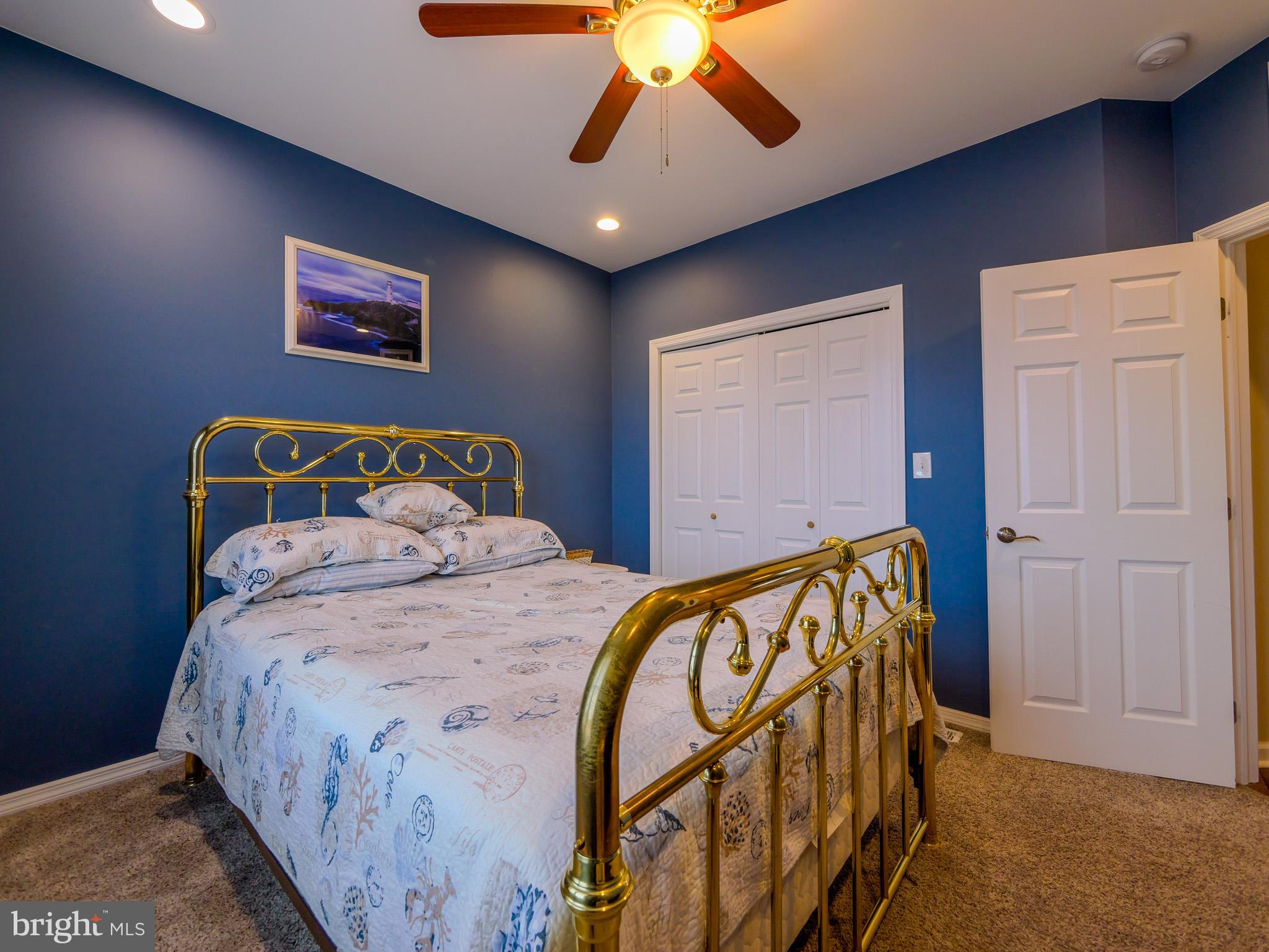 559 Franklinville Road Mullica Hill, NJ 08062 - Photo 24 of 41 a bedroom with bed and a chandelier