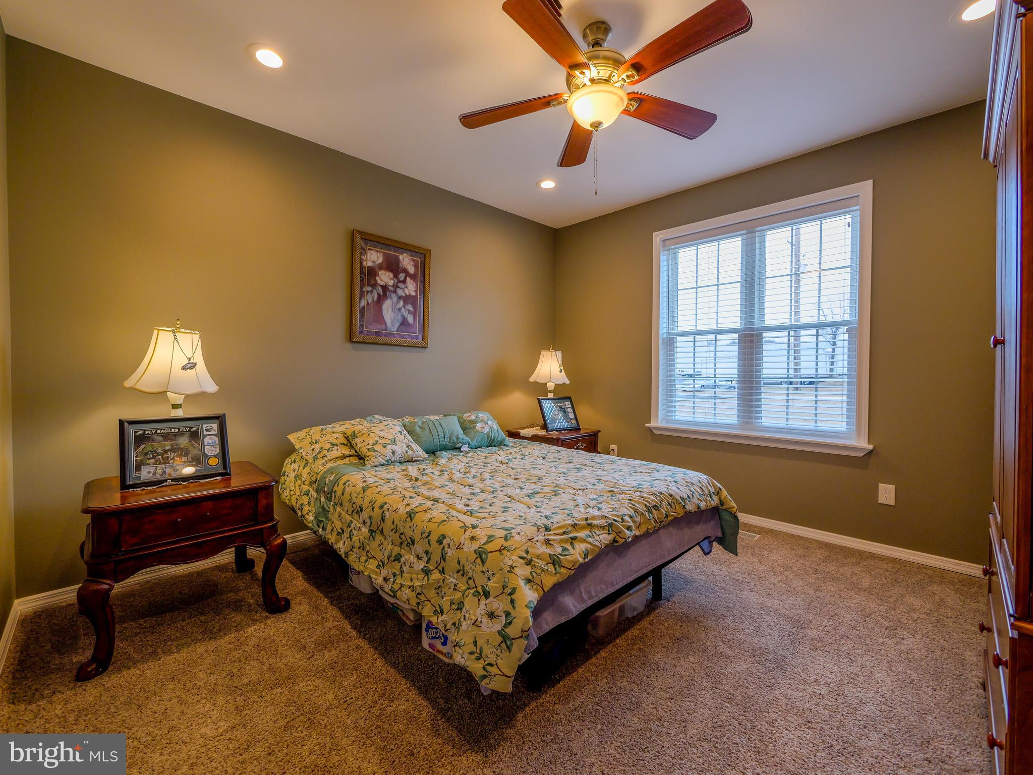 559 Franklinville Road Mullica Hill, NJ 08062 - Photo 25 of 41 a bedroom with a bed and a chandelier