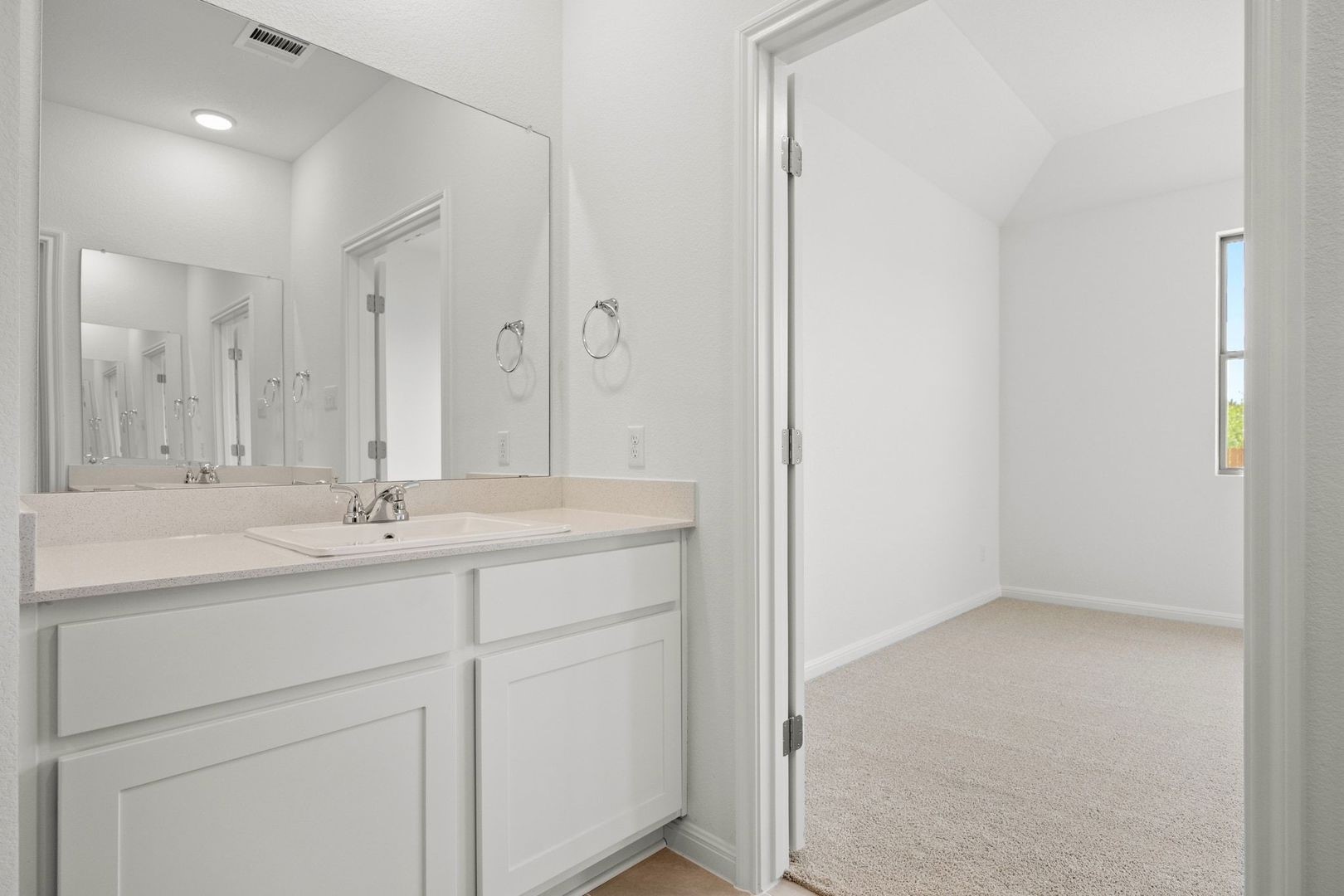 278 Bendecido Loop Elgin, TX 78621 - Photo 16 of 37 a bathroom with 2 sink and a mirror