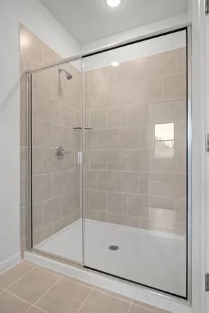 a bathroom with a shower and a bathtub