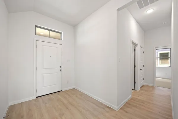 wooden floor in a hall with an entryway