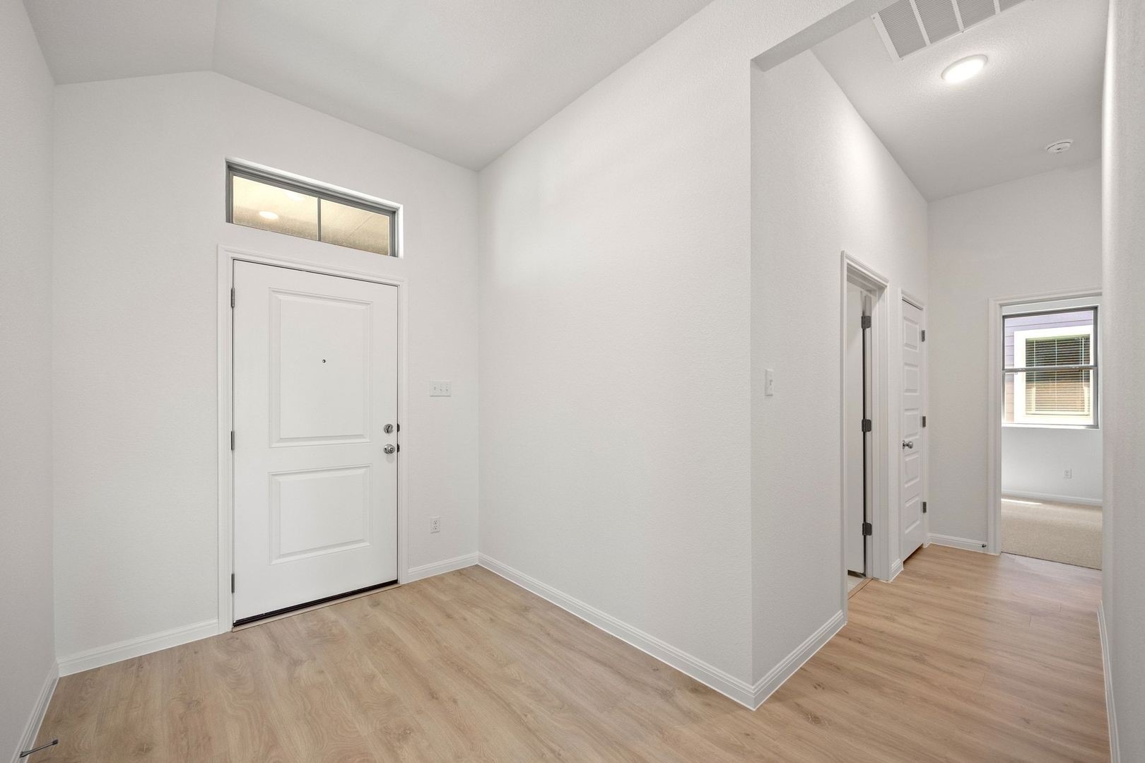 278 Bendecido Loop Elgin, TX 78621 - Photo 19 of 37 wooden floor in a hall with an entryway