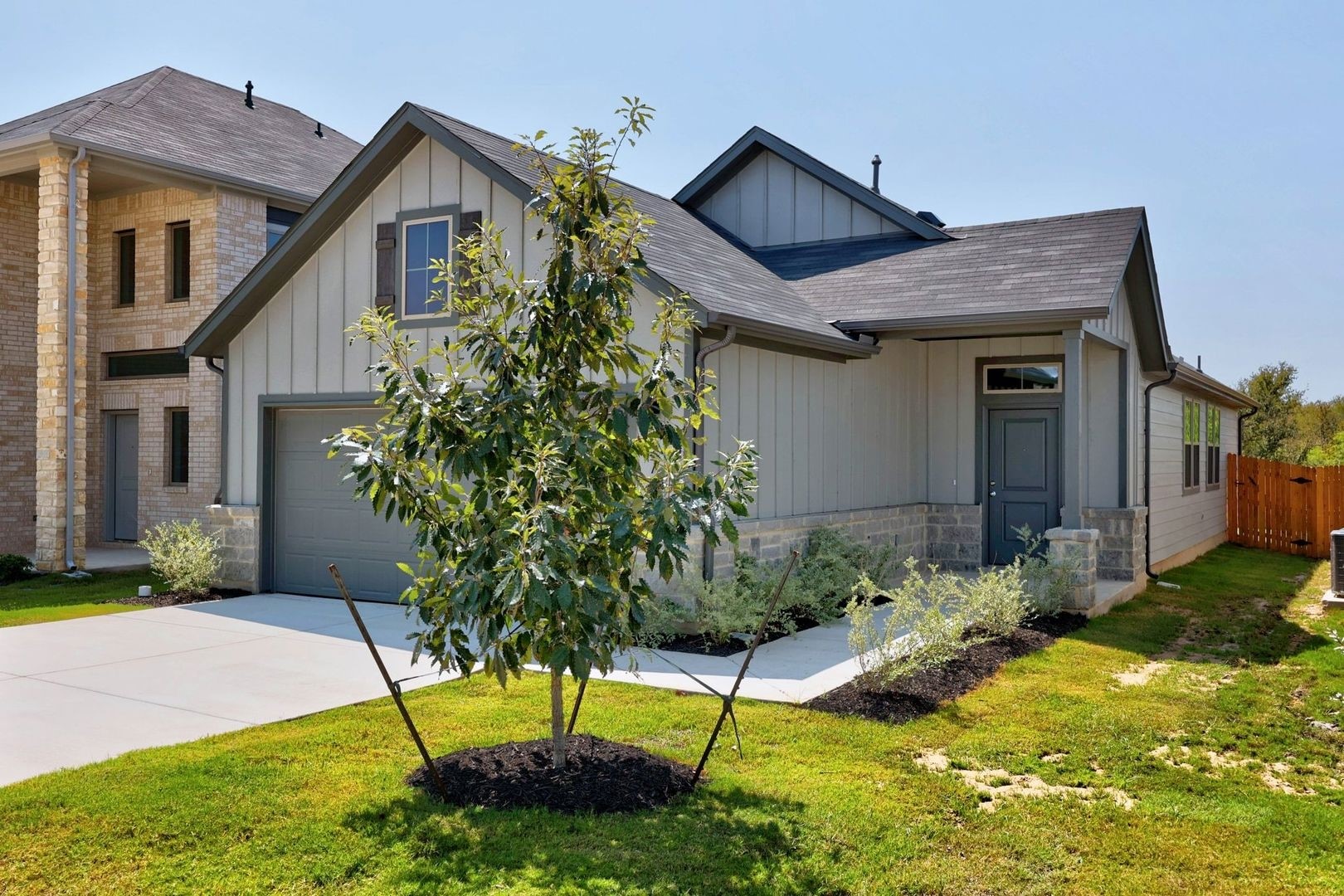 278 Bendecido Loop Elgin, TX 78621 - Photo 2 of 37 a house that has a lot of plants in it