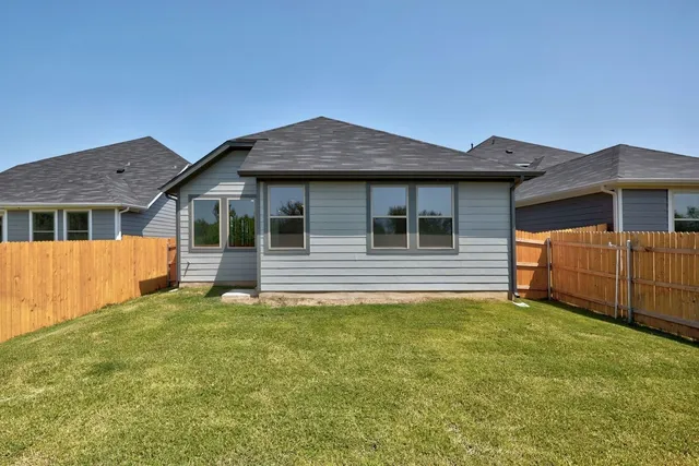 a view of deck and wooden fence