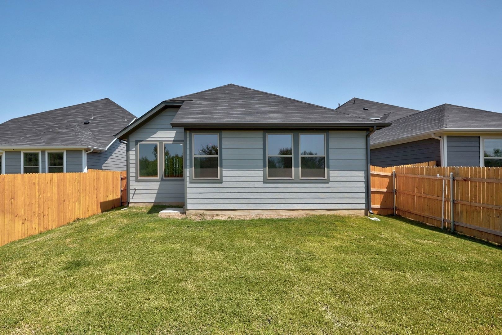 278 Bendecido Loop Elgin, TX 78621 - Photo 24 of 37 a house that has a big yard in front of it
