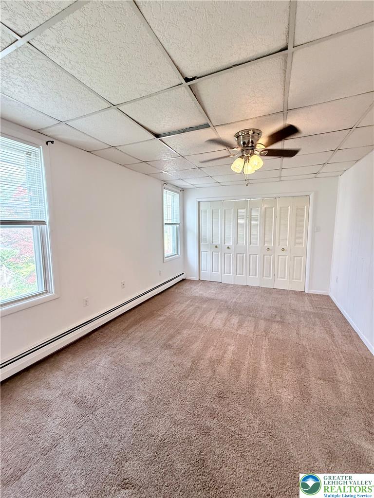 5540 Main Street Whitehall, PA 18052 - Photo 32 of 53 Primary bedroom with ample storage and inviting natural illumination.