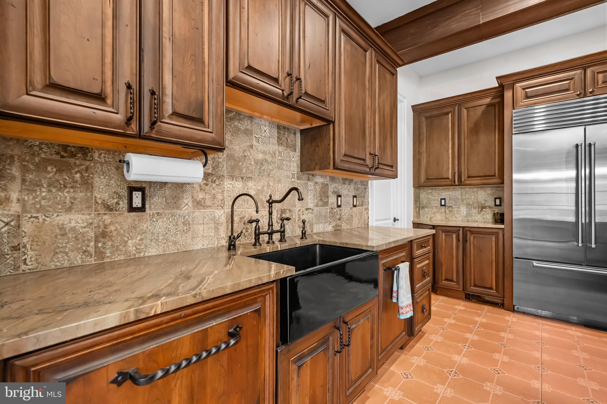 13025 Yates Ford Road Clifton, VA 20124 - Photo 12 of 82 a kitchen with stainless steel appliances granite countertop a sink stove and refrigerator