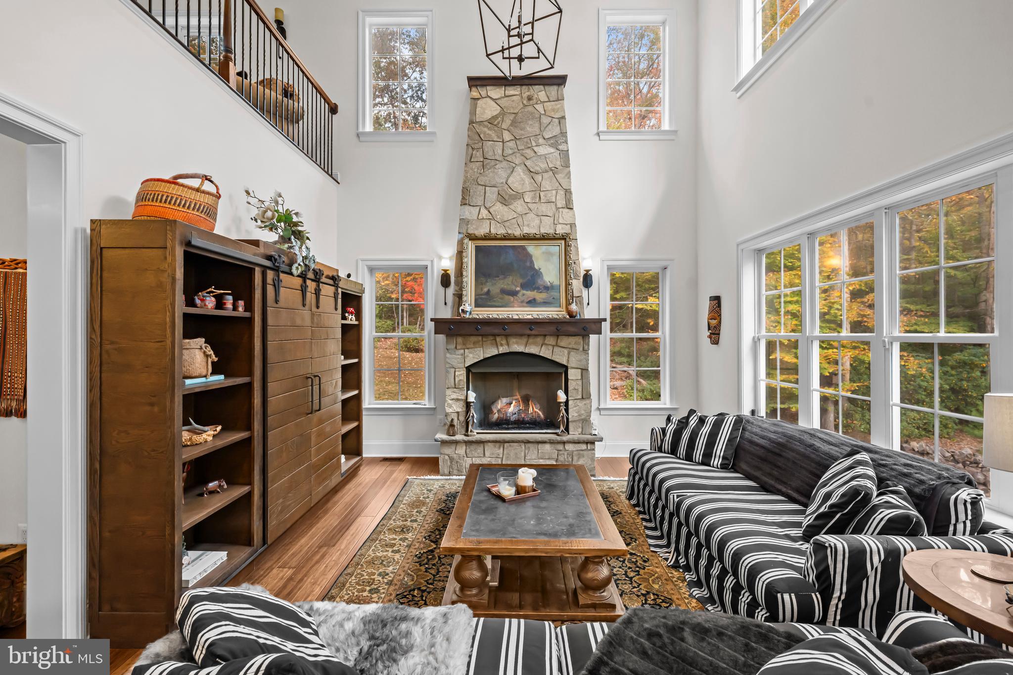13025 Yates Ford Road Clifton, VA 20124 - Photo 19 of 82 a living room with furniture and a fireplace