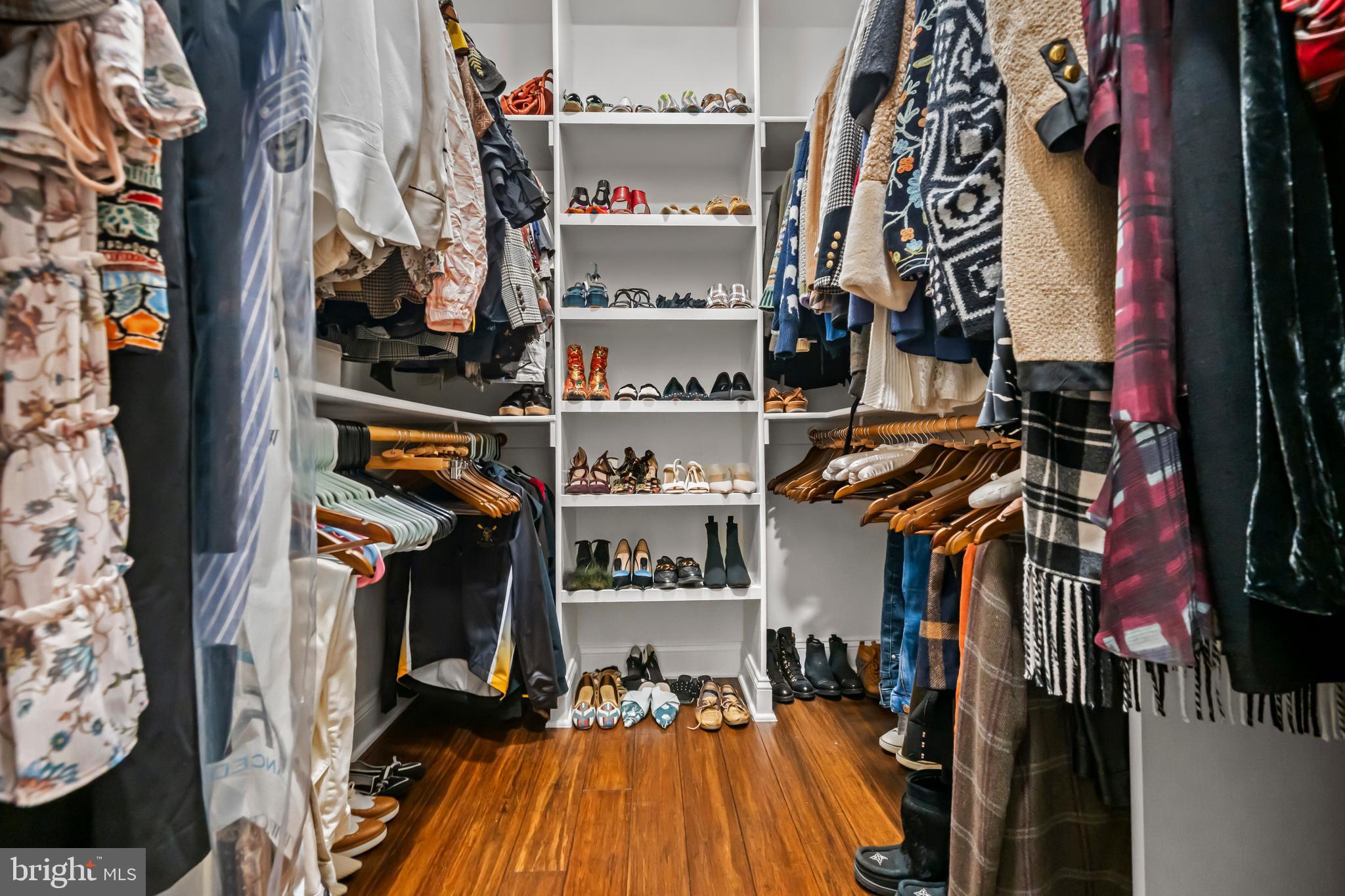 13025 Yates Ford Road Clifton, VA 20124 - Photo 34 of 82 a view of walk in closet with clothes and shoes