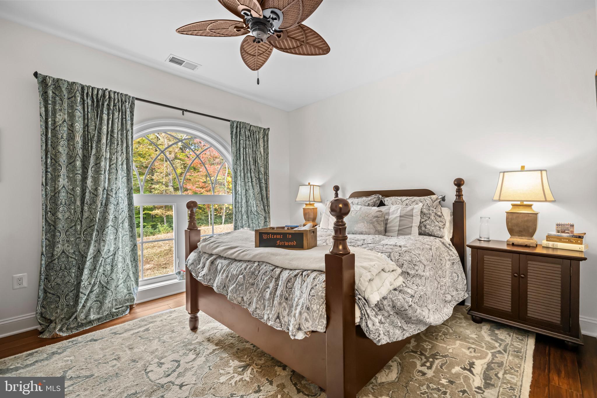 13025 Yates Ford Road Clifton, VA 20124 - Photo 39 of 82 a bedroom with a bed and a chandelier