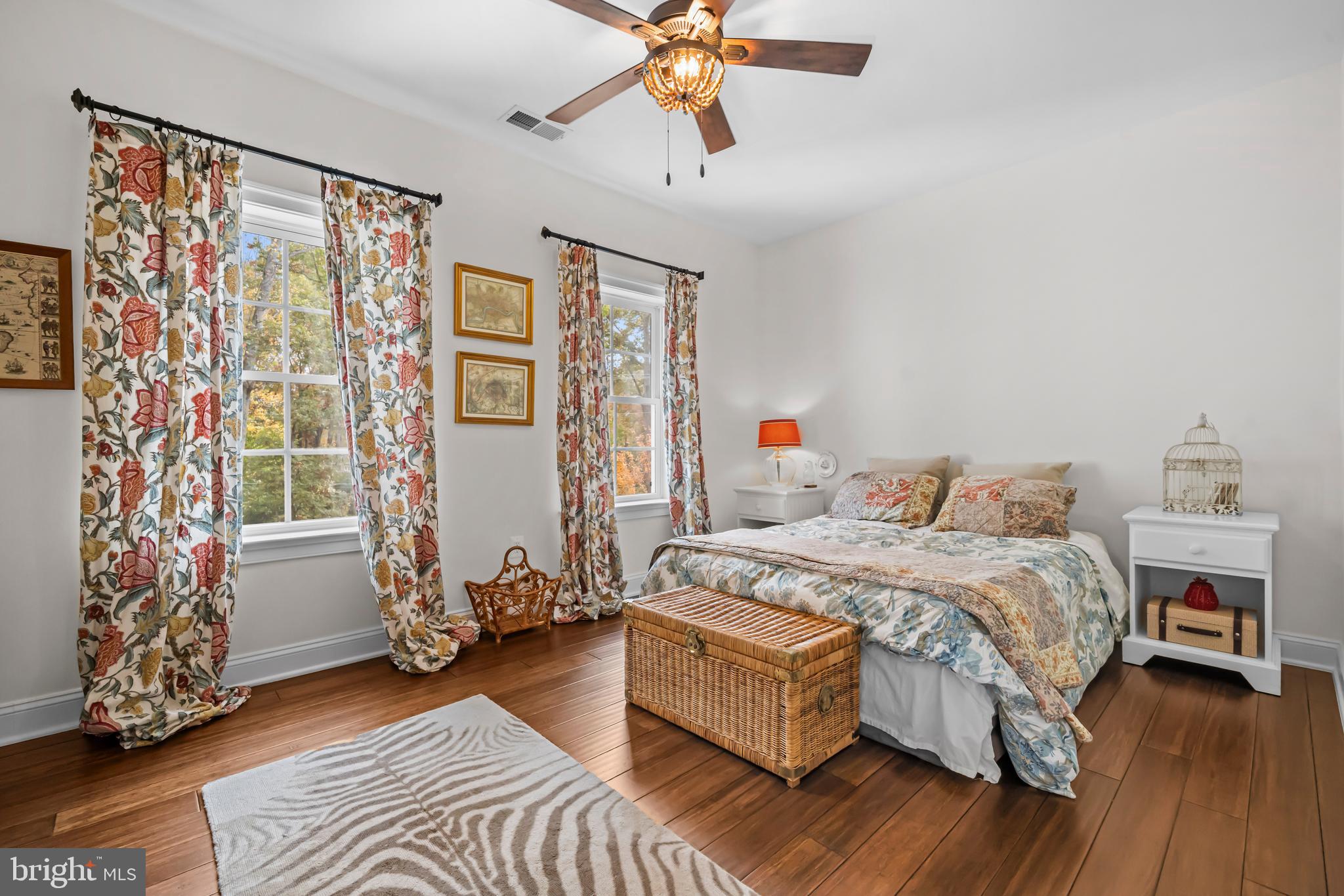 13025 Yates Ford Road Clifton, VA 20124 - Photo 42 of 82 a bedroom with a bed and a chandelier