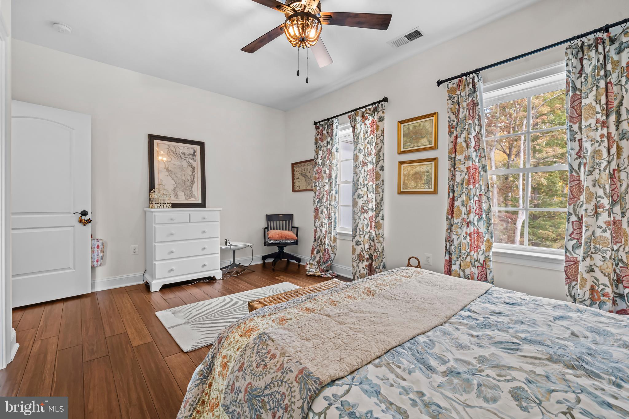 13025 Yates Ford Road Clifton, VA 20124 - Photo 43 of 82 a spacious bedroom with a bed and a chandelier