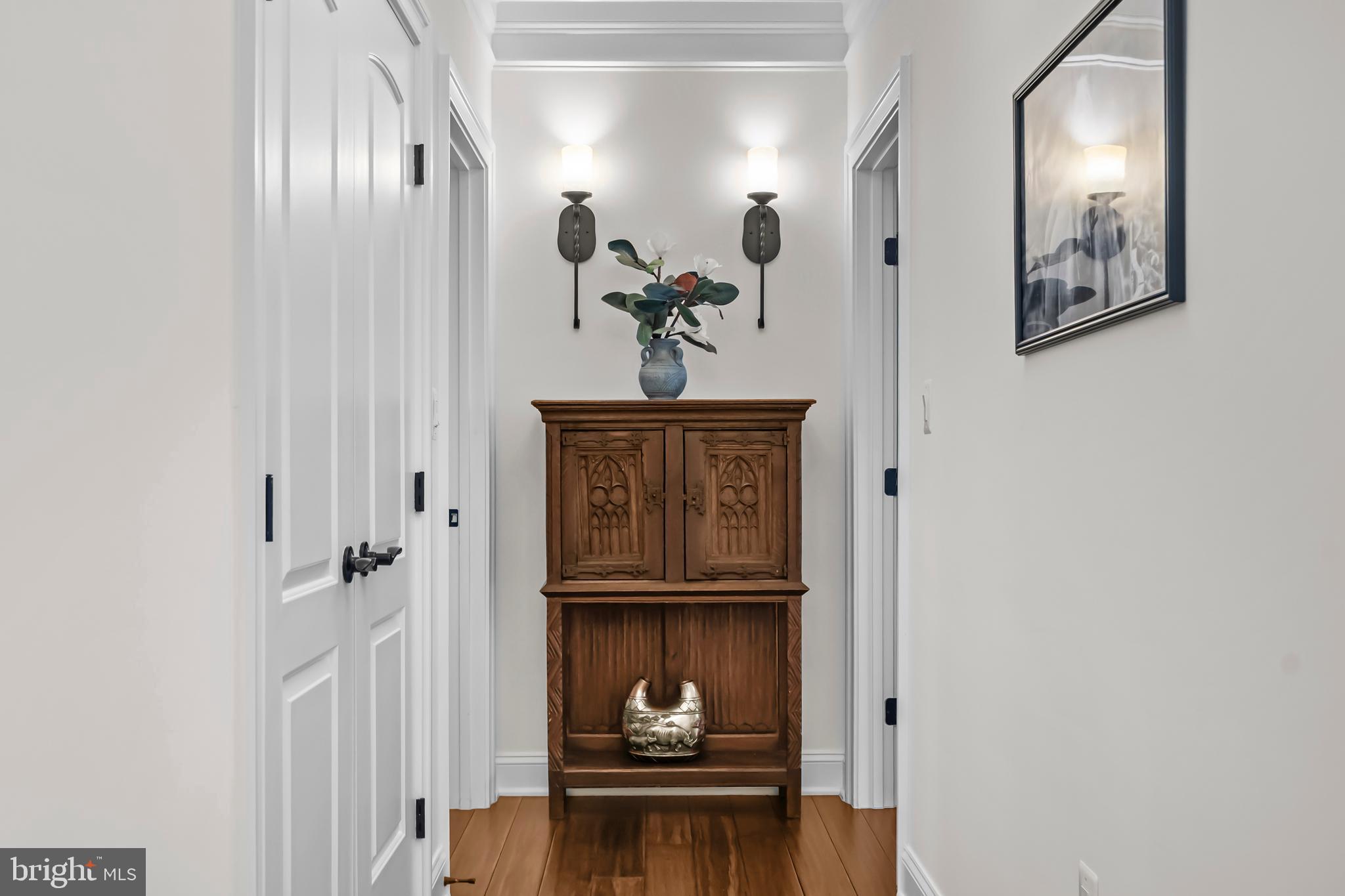13025 Yates Ford Road Clifton, VA 20124 - Photo 45 of 82 a view of a hallway with paintings on the wall