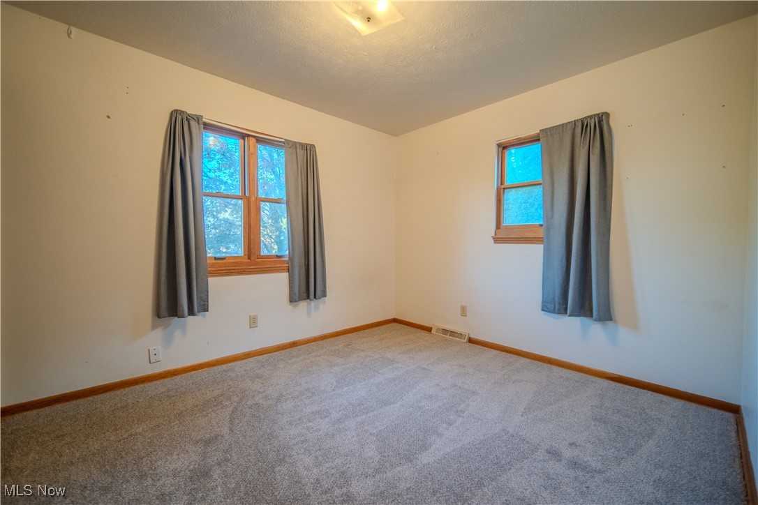 1206 Dussel Road Kent, OH 44240 - Photo 18 of 28 Unfurnished room featuring carpet flooring and a textured ceiling