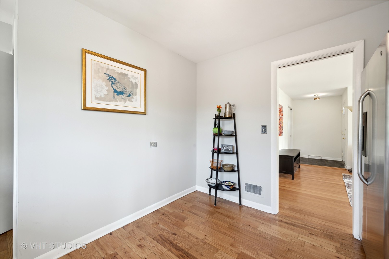 577 Ridge Road Highland Park, IL 60035 - Photo 16 of 20 a view of a hallway with wooden floor and a cabinet