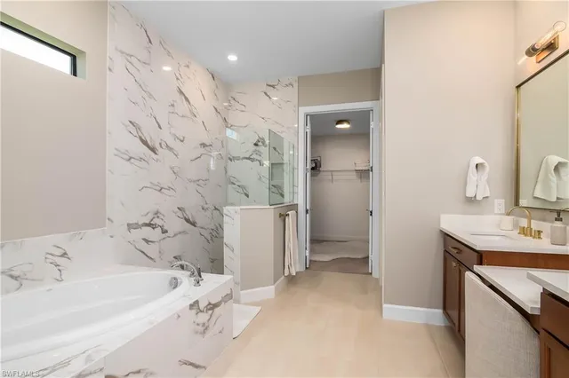 a bathroom with a bathtub sink and toilet