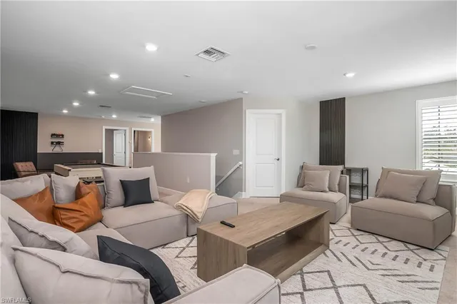 a living room with furniture and a table