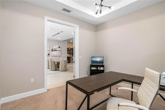 a view of a room with shelves and wooden floor