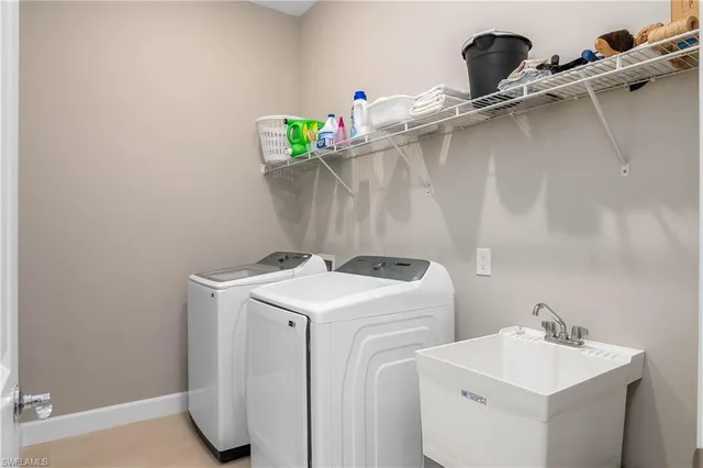 a utility room with dryer and washer