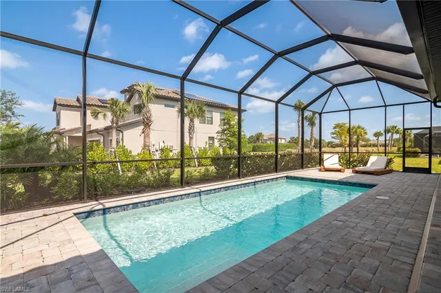 a view of a swimming pool with a porch