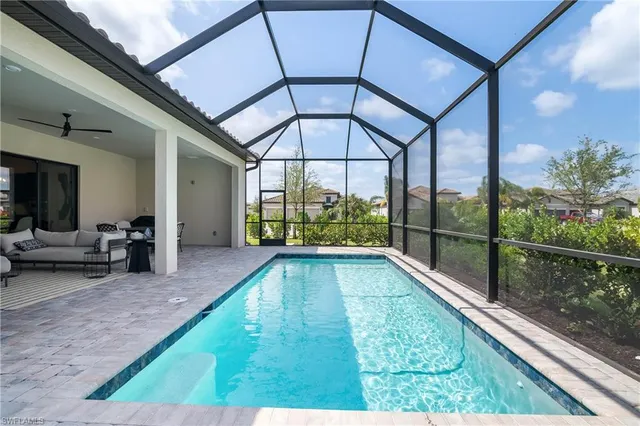 a view of swimming pool with seating area
