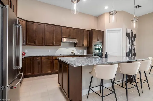 a kitchen with a sink cabinets and window