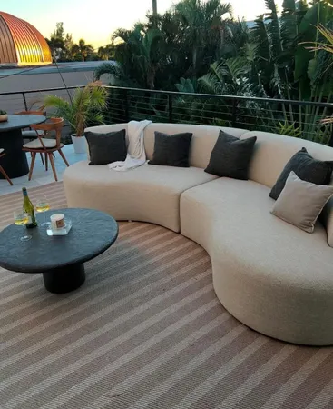 a view of a backyard with sitting area