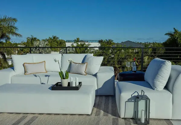 a backyard of a house with table and chairs