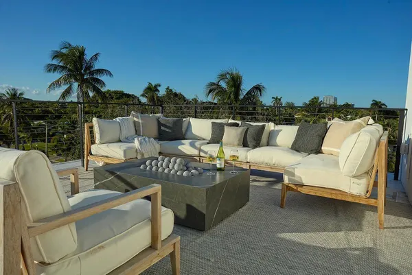 a view of a chairs and table in patio