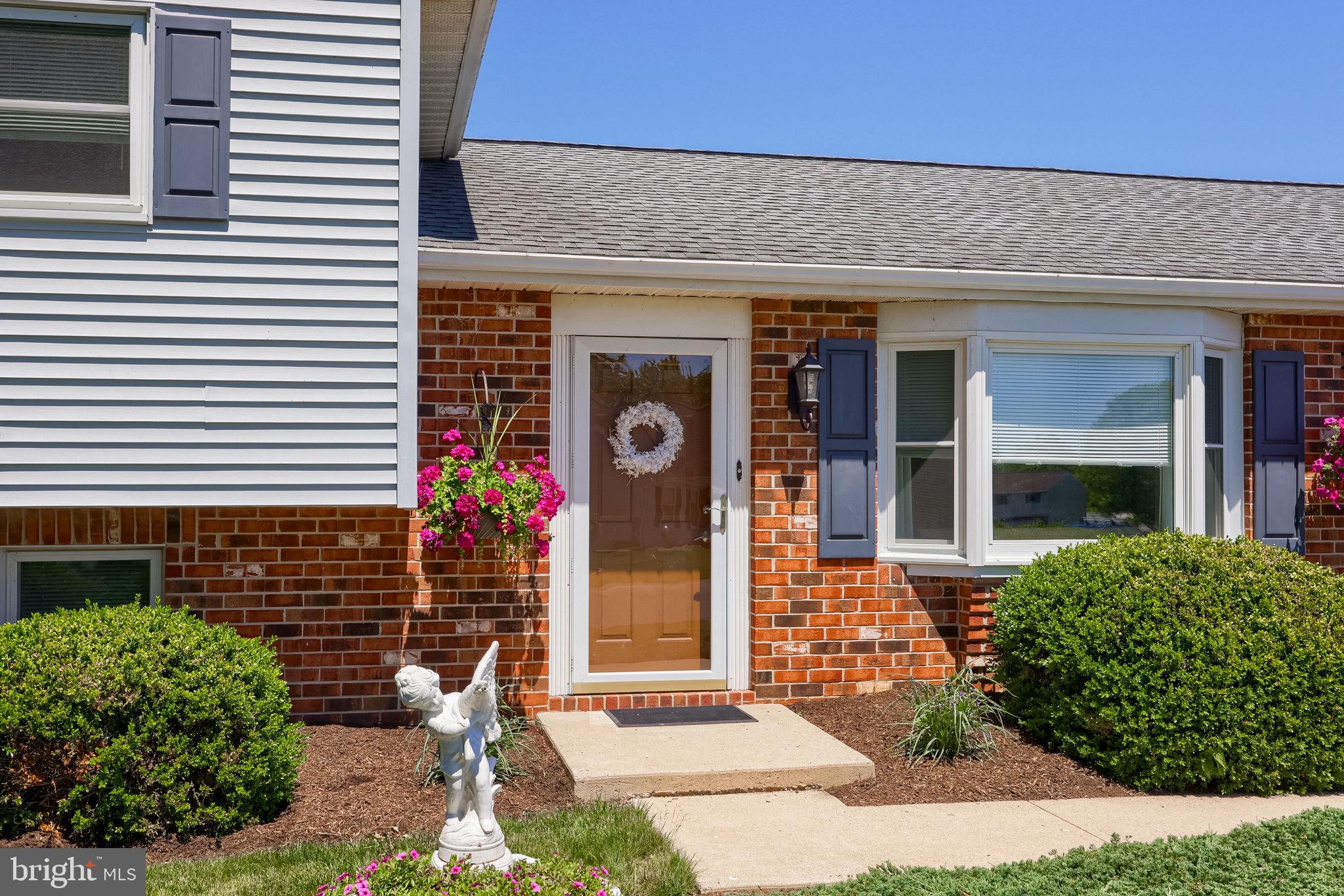 91 Buchland Road Ephrata, PA 17522 - Photo 4 of 59 Charming entryway with vibrant blooms.