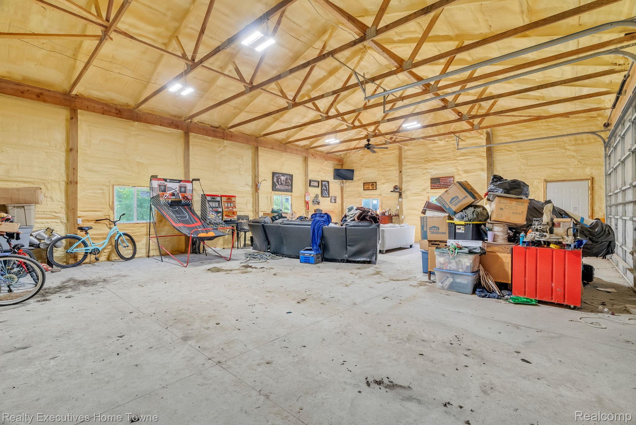 6560 Roach Road Lexington, MI 48450 - Photo 33 of 36 Spacious interior structure featuring exposed timber framing and concrete flooring