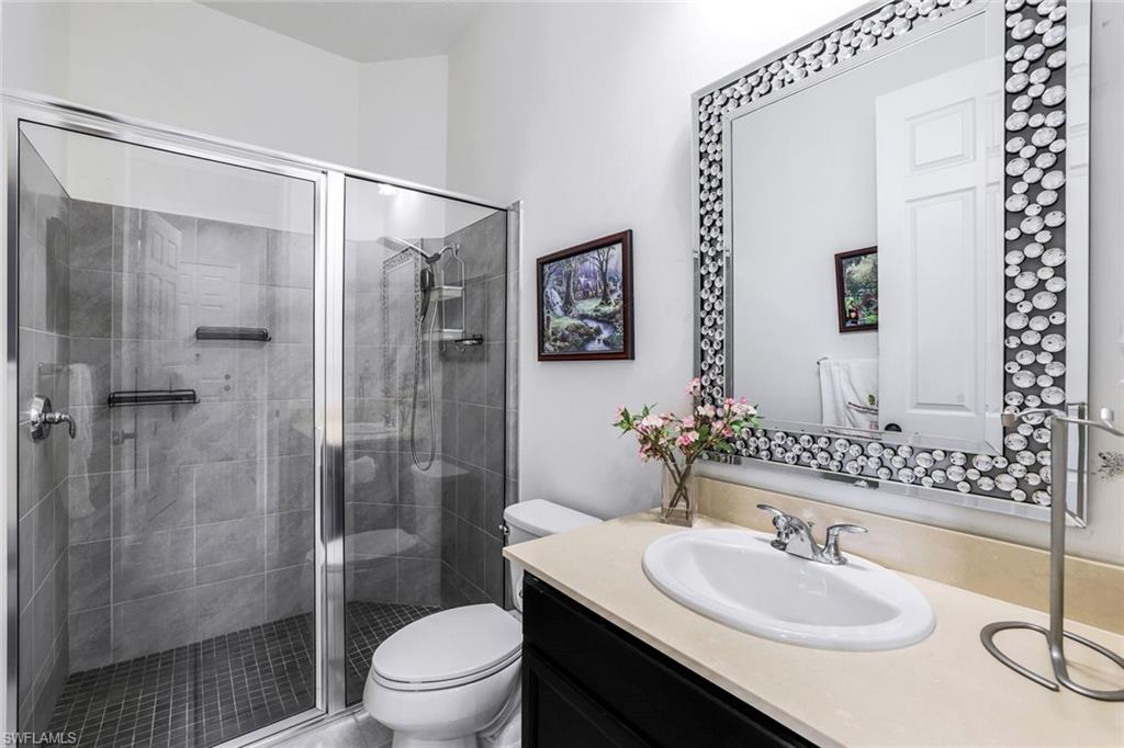 4795 Rosetta Terrace Immokalee, FL 34142 - Photo 12 of 27 Bathroom with vanity and a shower stall
