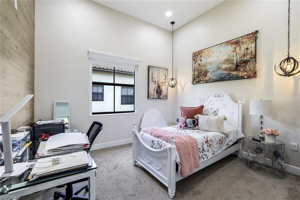 4795 Rosetta Terrace Immokalee, FL 34142 - Photo 13 of 27 Bedroom with carpet and an office area