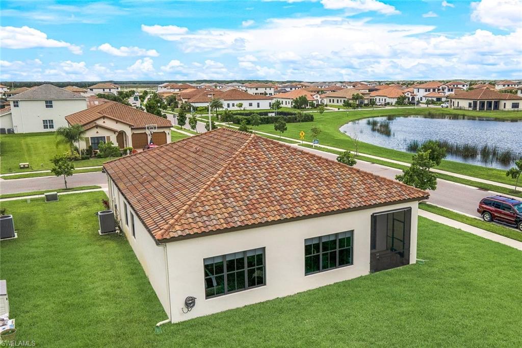 4795 Rosetta Terrace Immokalee, FL 34142 - Photo 22 of 27 Aerial view of residential area featuring a nearby body of water
