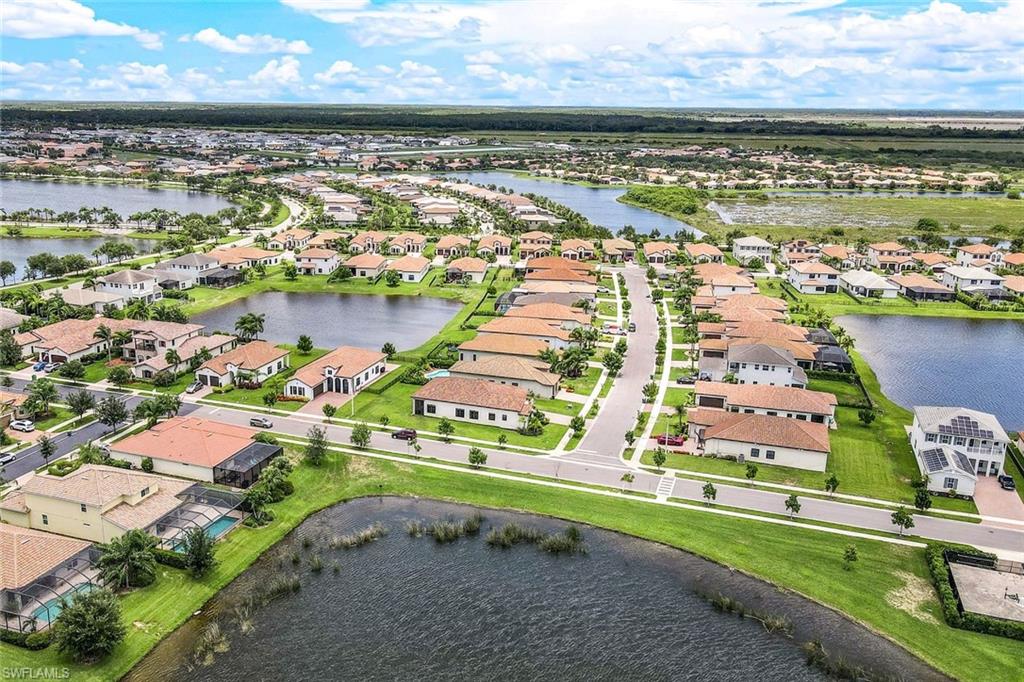 4795 Rosetta Terrace Immokalee, FL 34142 - Photo 23 of 27 Aerial view of residential area featuring a nearby body of water