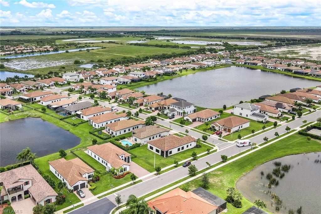4795 Rosetta Terrace Immokalee, FL 34142 - Photo 25 of 27 Aerial perspective of suburban area with a large body of water