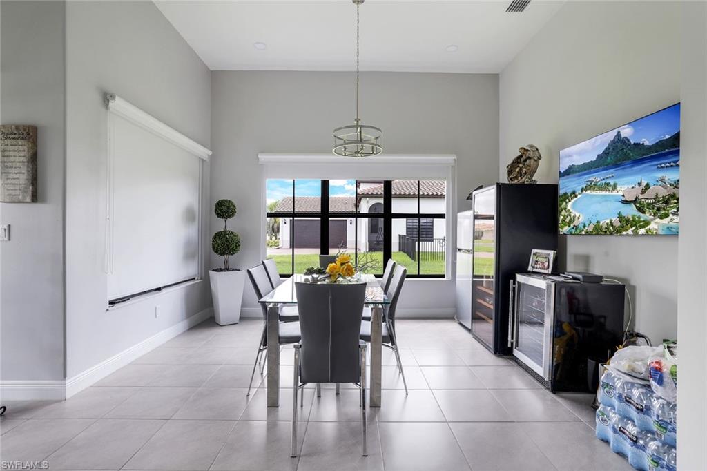 4795 Rosetta Terrace Immokalee, FL 34142 - Photo 7 of 27 Dining area featuring light tile patterned floors and baseboards
