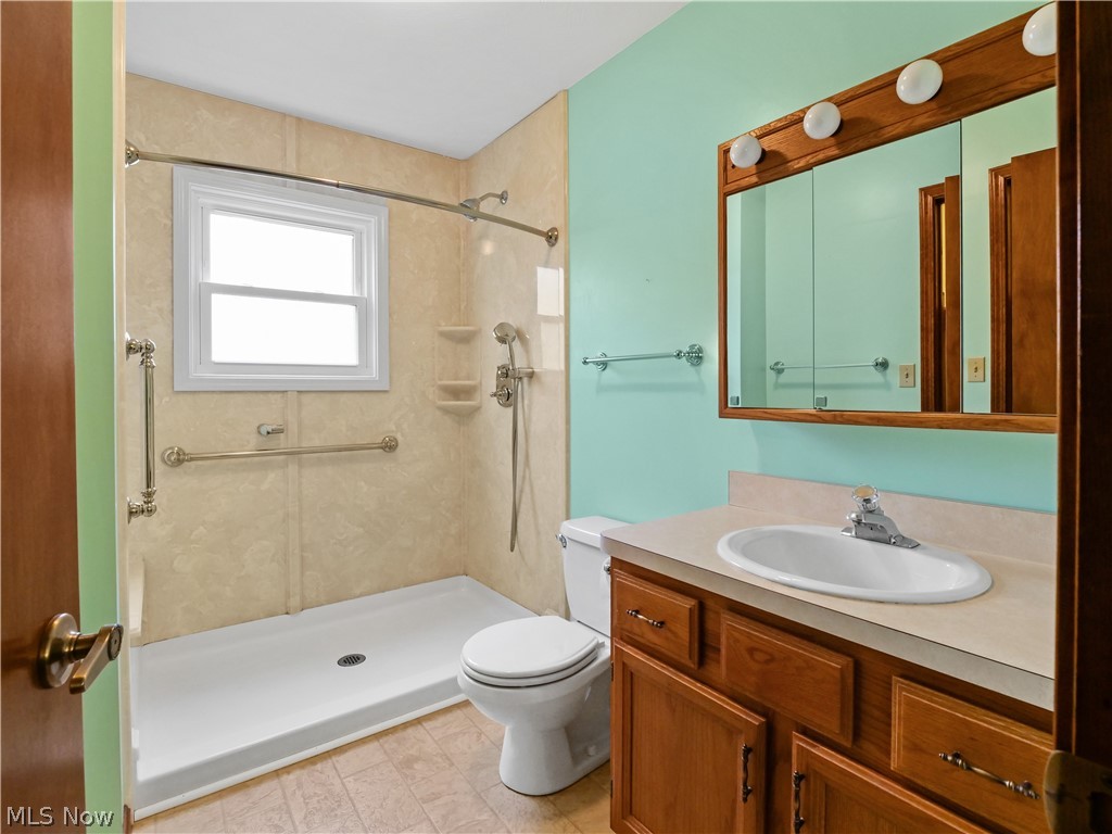 5175 Case Road North Ridgeville, OH 44039 - Photo 16 of 28 Bathroom with walk in shower, tile flooring, toilet, and vanity