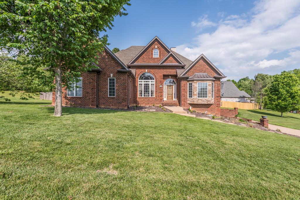 7302 Allans Ridge Lane Fairview, TN 37062 - Photo 2 of 30 a front view of a house with a yard and garage