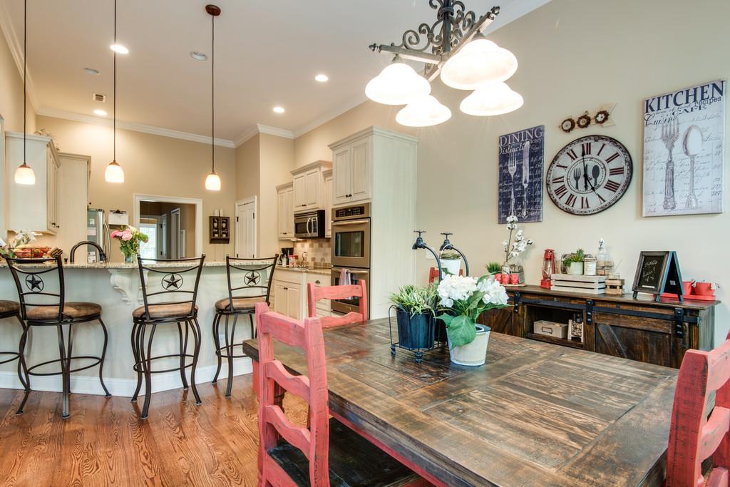 7302 Allans Ridge Lane Fairview, TN 37062 - Photo 16 of 30 a view of a dining room with furniture and wooden floor