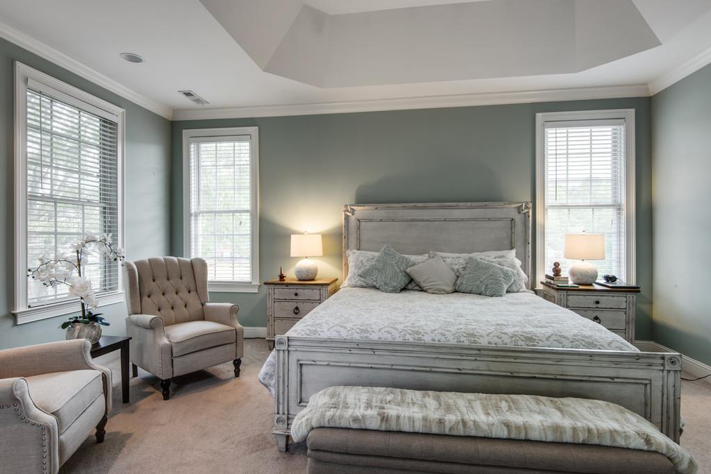 7302 Allans Ridge Lane Fairview, TN 37062 - Photo 18 of 30 a bedroom with a bed and glass window
