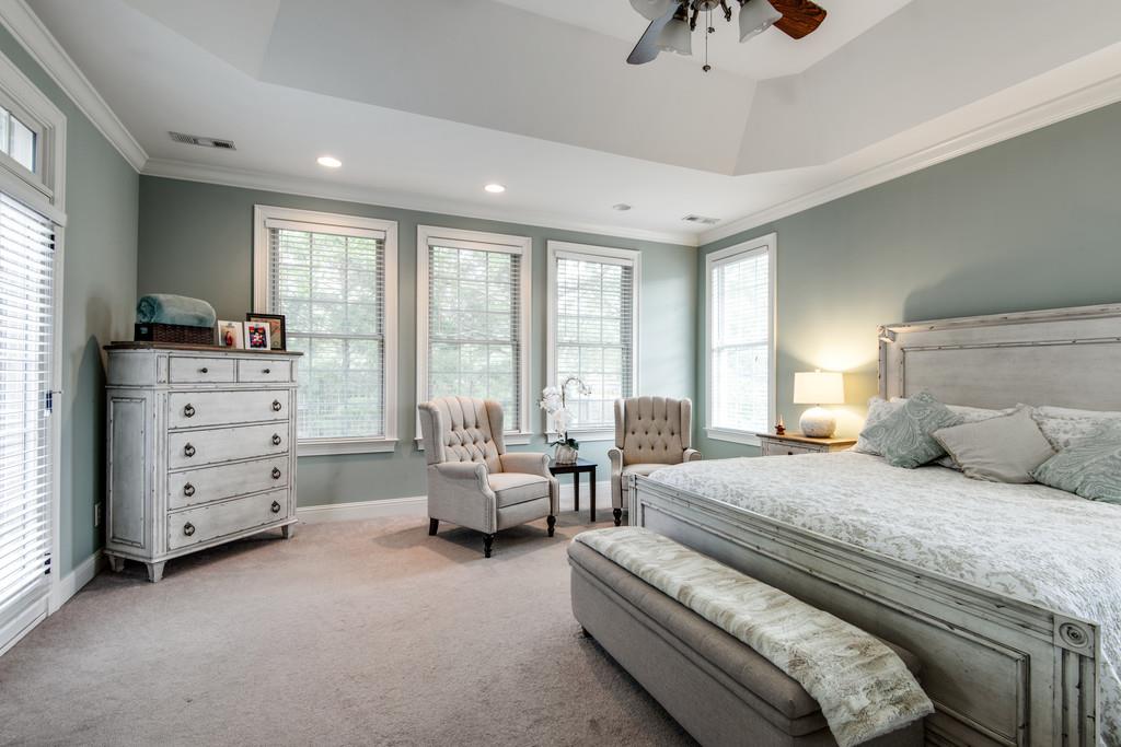 7302 Allans Ridge Lane Fairview, TN 37062 - Photo 19 of 30 a bedroom with a bed and large windows
