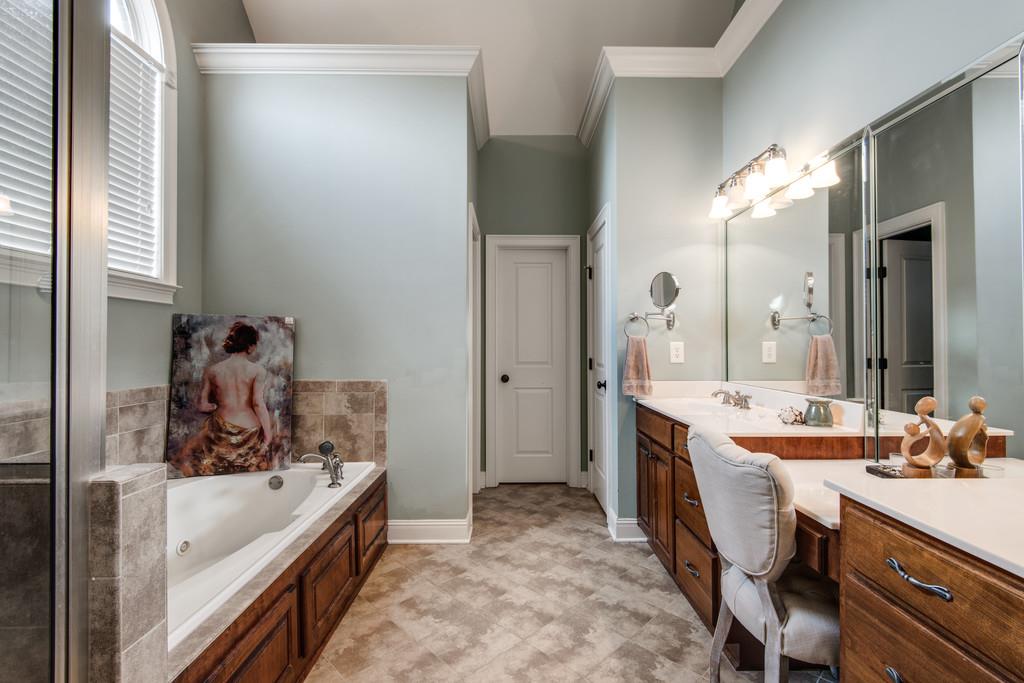 7302 Allans Ridge Lane Fairview, TN 37062 - Photo 20 of 30 a bathroom with a tub sink and mirror