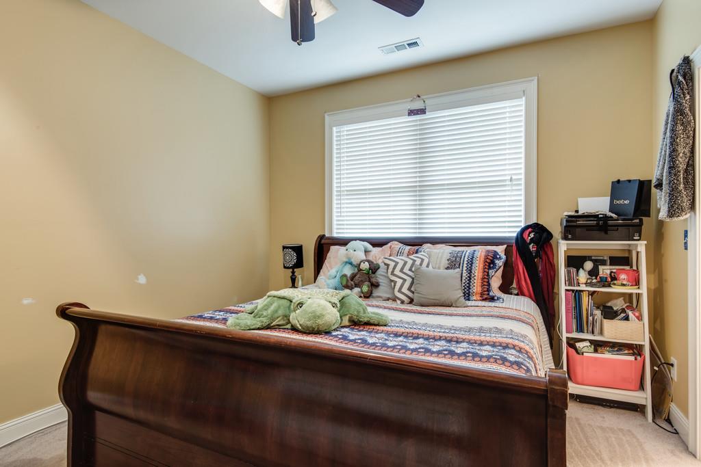 7302 Allans Ridge Lane Fairview, TN 37062 - Photo 24 of 30 a bedroom with a bed and a window