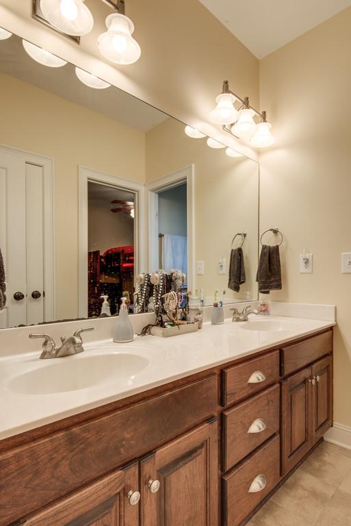 7302 Allans Ridge Lane Fairview, TN 37062 - Photo 25 of 30 a bathroom with a sink and a mirror