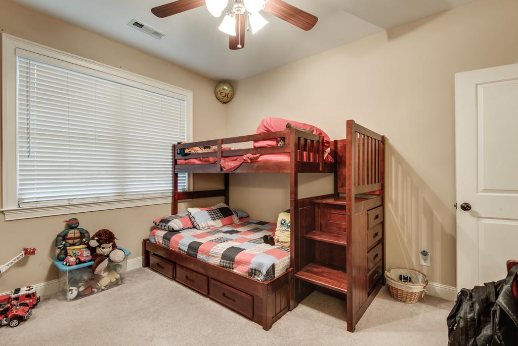7302 Allans Ridge Lane Fairview, TN 37062 - Photo 26 of 30 a bedroom with a bed and a chandelier
