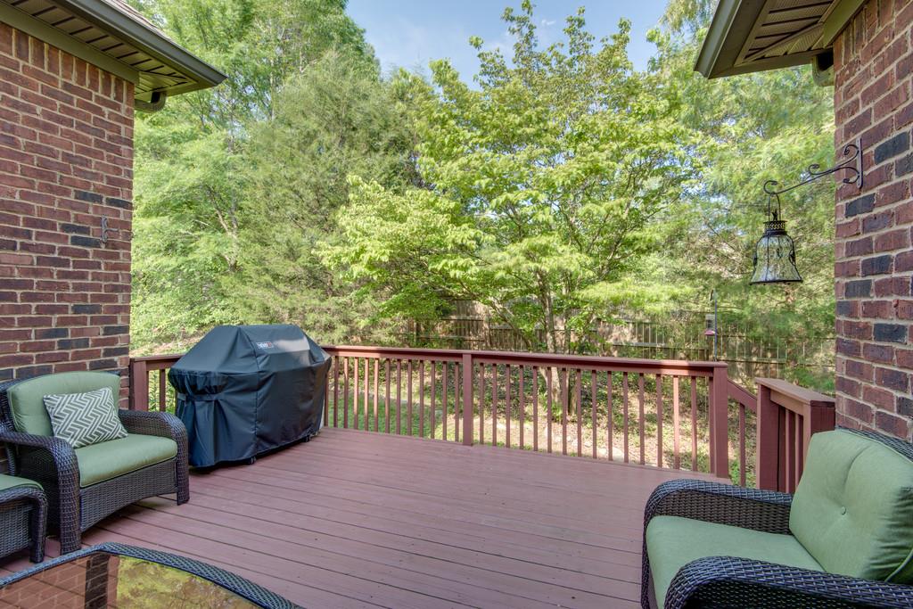 7302 Allans Ridge Lane Fairview, TN 37062 - Photo 28 of 30 a balcony with wooden floor and a couch